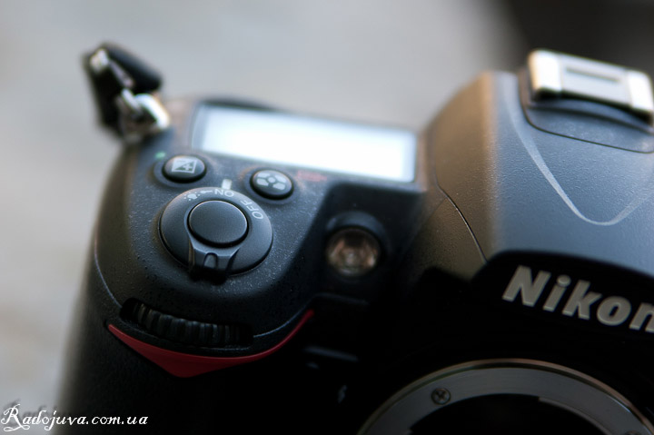 Black shutter button on the D7000. View of the shutter button and monochrome display.