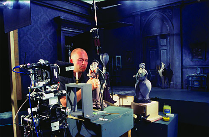 Animator Peter Dodd builds a stage with dolls from the 'Corpse of the Bride'. Photo courtesy of Warner Bros. Pictures. for stopmotionworks.com