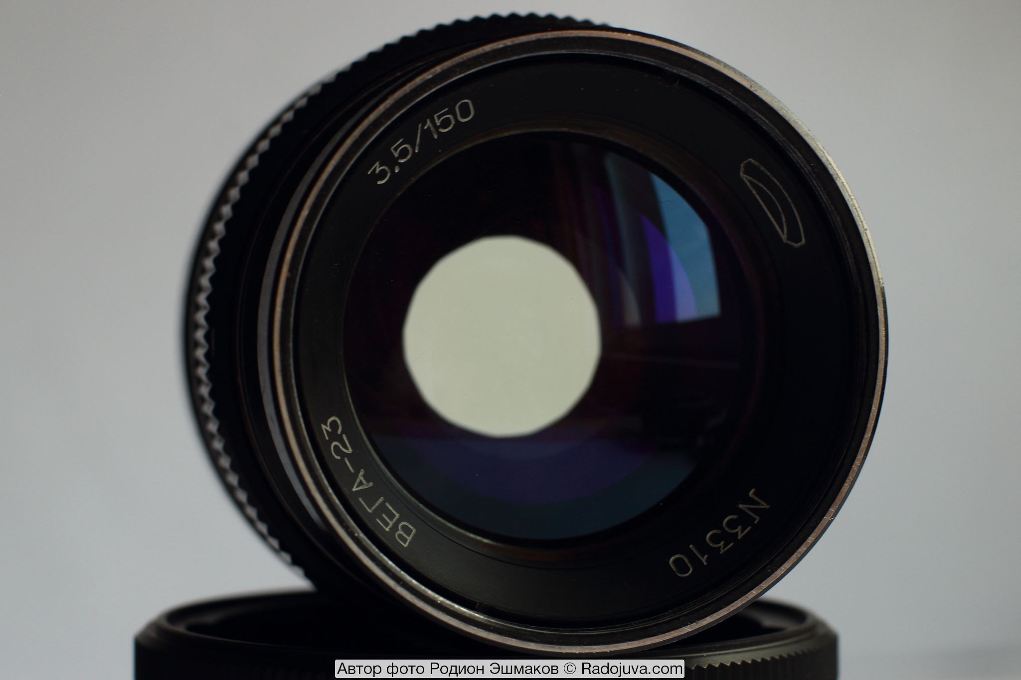 View of the lens with a covered aperture in the light. The yellowness of the glass is noticeable.