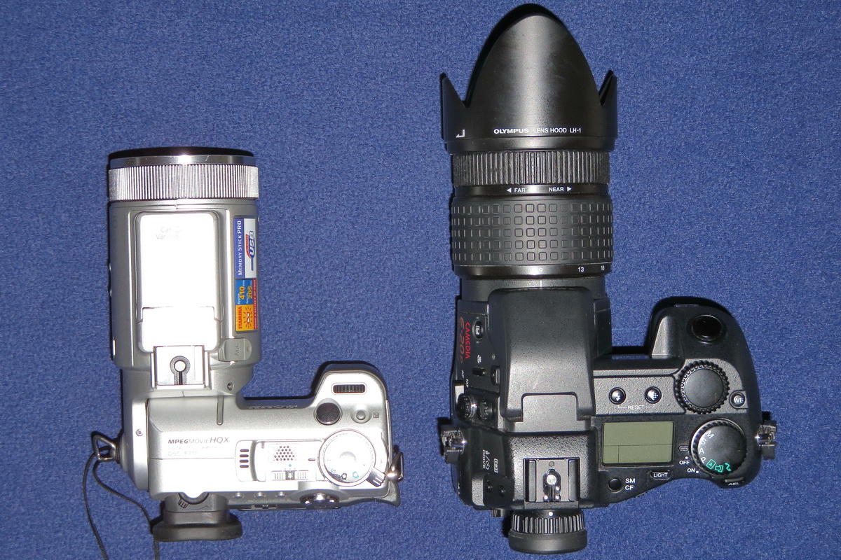 Compare the dimensions of two "compact" cameras: Sony F717 and Olympus E-20