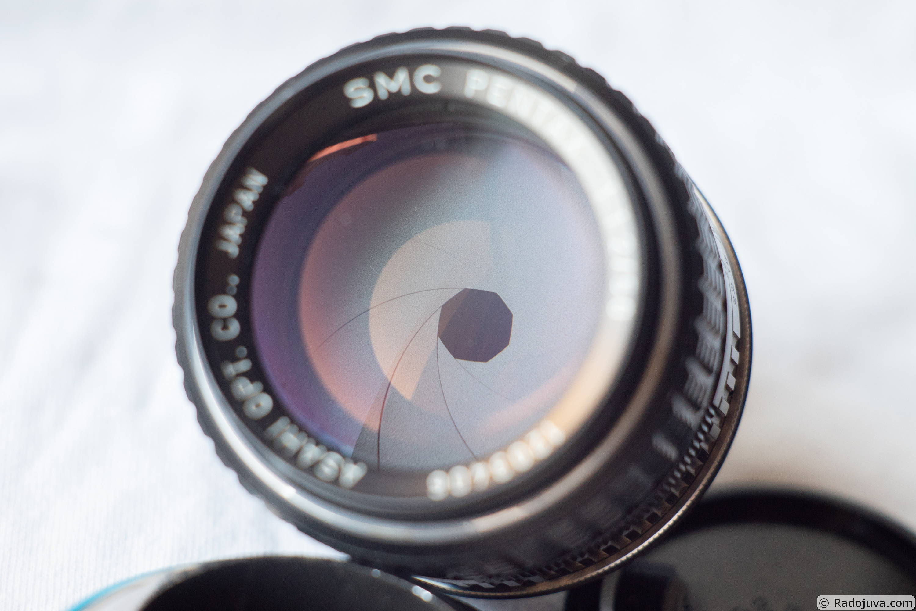 Pentax 50/1.2 aperture blades have a matte black finish.